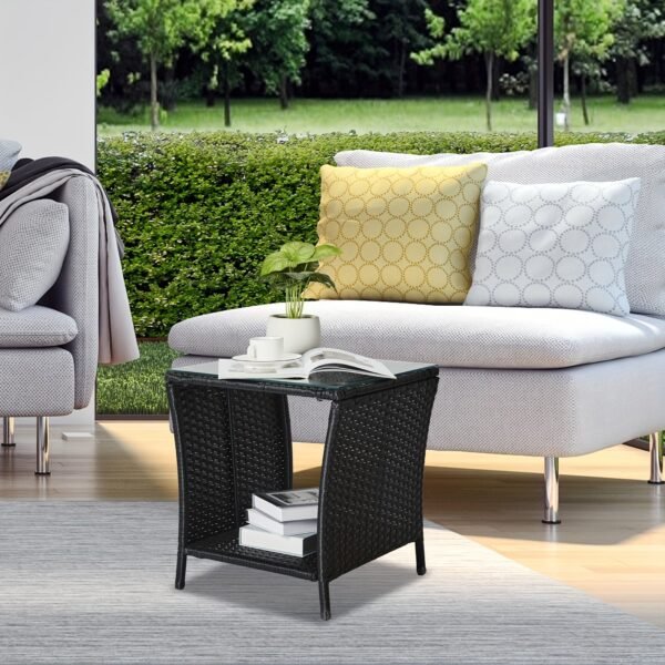 2bb5a0fc-af1a-4fbc-ae9d-328379e33359-1.jpg "A black four-line rattan double-layered side table with glass top, suitable for small living rooms in households